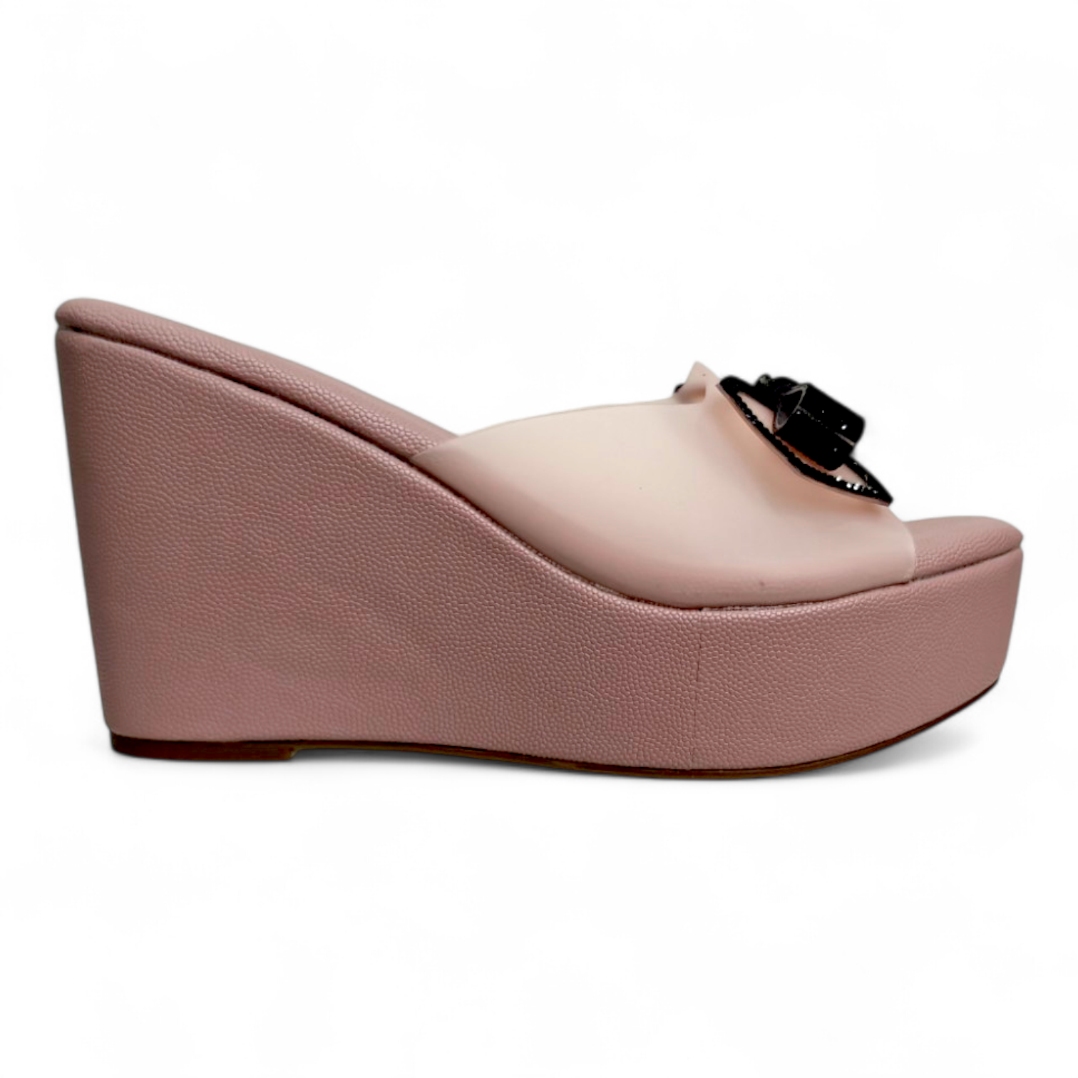 Side view of peach wedge heel footwear with transparent belt and elegant bow on top